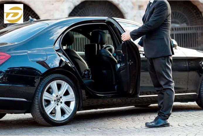 Professional chauffeur greeting traveler at Addison Airport in Dallas